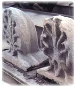 Picture of stone sculpture that has been damaged by acid rain and fog.