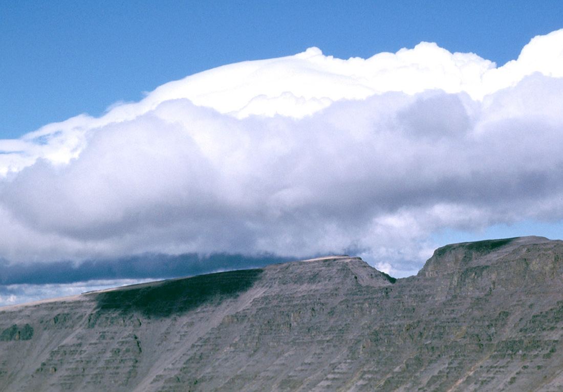 Picture of clouds condensing as the air is pushed up a mountain side, Kiger Notch, Steen's Mountain, Washington state, USA.
