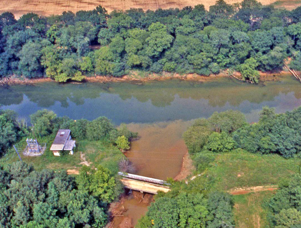 Sediment-laden water from a tributary, where development is probably taking place, entering the clearer Chattahoochee River near Atlanta, Gerogia, USA (Credit: USGS)