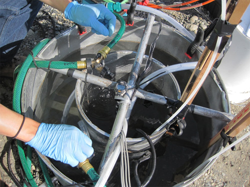  [Photo: Close-up view of tracer experiment infiltration equipment] 