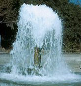  [Photo: Ground water flowing out of well.] 