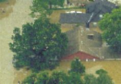 [Photo: Figure 4 - Flooded homes.] 