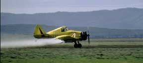 A picture of a dust cropping plane