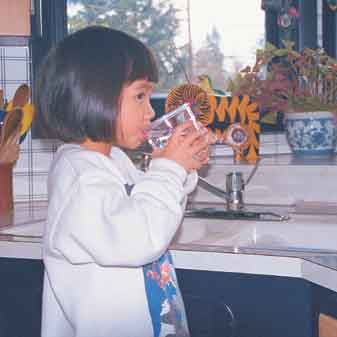 Photo of a young girl drinking water