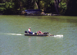 Tow vehicle being pushed by motorboat
