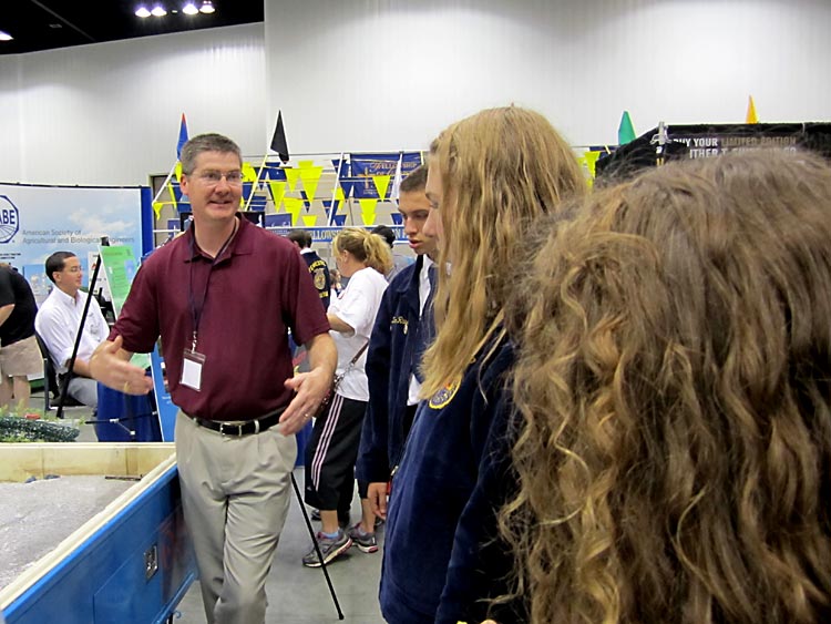 An Oklahoma Water Resources Research Institute scientist gives a stream trailer demonstration at a Future Farmers of America convention.