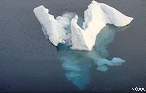 Iceberg, showing some of it is below the water surface.