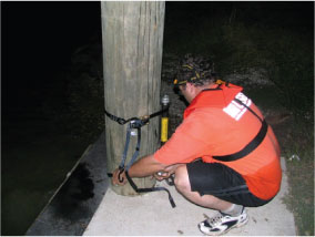 USGS hydrographer deploying a storm-surge sensor prior to Hurricane Rita