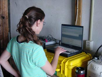  [Figure 4 - Photo: Scientist operates laptop computer] 