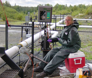   [Photo: Scientist operated borehole radar equipment.] 