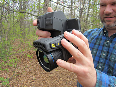  [Photo: USGS scientists holding thermal imaging camera] 