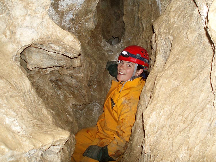 A graduate student, supported by the Texas Water Resources Institute, works in a crevasse as part of a karstaquifer study.